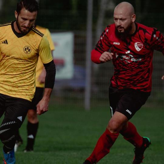 Soccer Player Dribbling Past Two Defenders with Skill