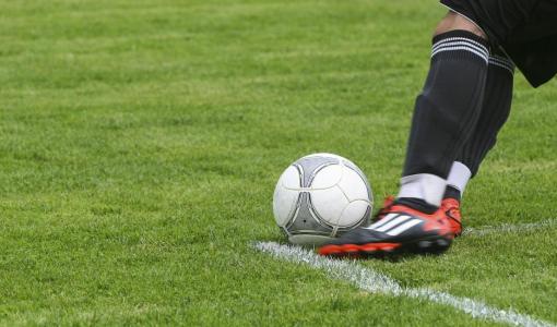 Goalkeeper Preparing for a Powerful Goal Kick in Soccer