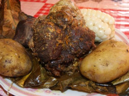 Cooking beef Pachamanca traditional Inca-style